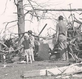 Family amongst the damage of the tornado